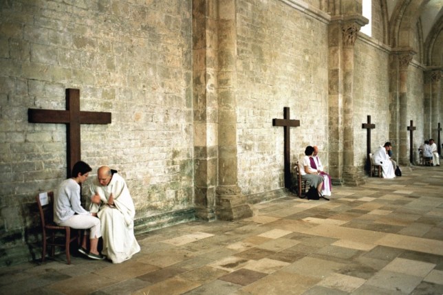 July 2007, Vezelay, France --- Confession during the St. Mary Magdalene festival in Vezelay. A UNESCO World Heritage Site, Vezelay is one of France's most beautiful historic villages. It is known for the Basilique Sainte-Marie-Madeleine, or the Basilica of St. Mary Magdalene, an important pilgrimage site on St. James' Way. --- Image by © Yves Gellie/Corbis